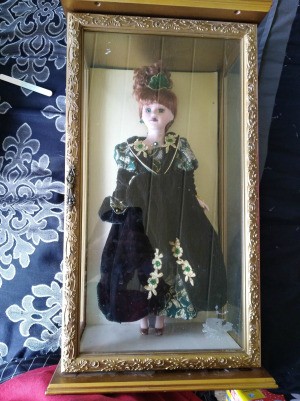 Identifying a Porcelain Doll - doll in a gold finish box