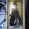 Identifying a Porcelain Doll - doll in a gold finish box