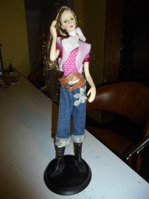 Identifying a Porcelain Doll - doll wearing jeans and boots