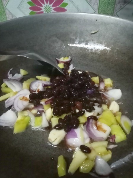 black beans added to pan