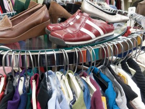 A rack of clothing at a thrift store.