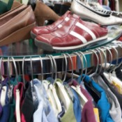 A rack of clothing at a thrift store.