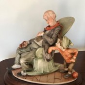 Value of Giuseppe Armani Figurine - old man sleeping in a rocking chair with a young boy standing next to it