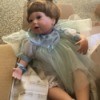Selling an Ashton Drake Doll Collection - baby doll wearing a blue dress