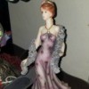 Value of a Regency Fine Arts Figurine - woman in a purple evening gown