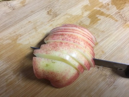 How to Make Apple Bunnies and Flowers - cut other chunk into thin slices