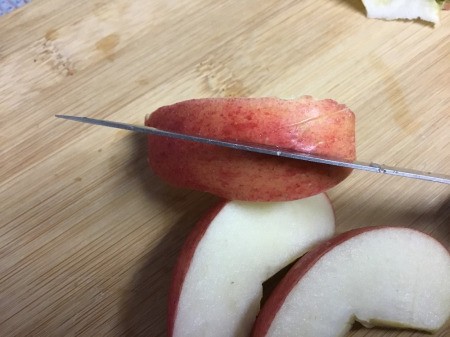 How to Make Apple Bunnies and Flowers - cut a small V shape out of one wedge