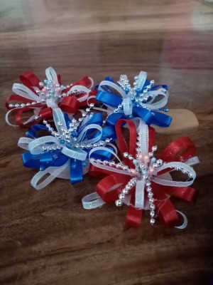 Exploding Fireworks Ribbon Crowns - two red and white and two blue and white crowns