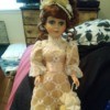 Value of a DanDee Porcelain Doll - doll in lace dress with matching unbrella
