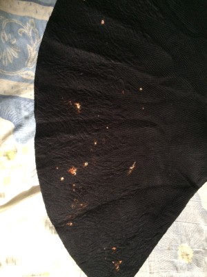 Removing Bleach Stains from Clothing - bleached spots on a black shirt