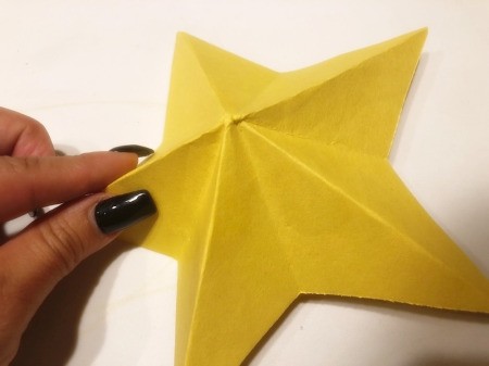 3D Kirigami Paper Stars - reinforce creases so main bits of the star are down and pieces in between are folded up