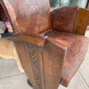 Identifying an Antique or Vintage Oak Chair - oak chair with leather covered back and seat, carving down the sides,  and wooden claw feet
