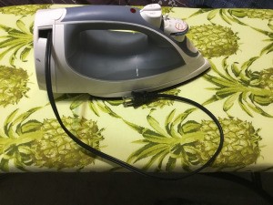 Retractable Iron Cord Stuck Inside  - clothing iron with cord only partially pulled out