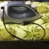 Retractable Iron Cord Stuck Inside  - clothing iron with cord only partially pulled out