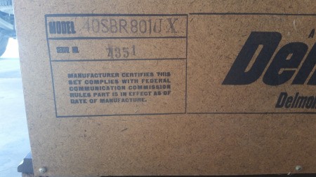 The marking on the back of a Delmonico stereo.