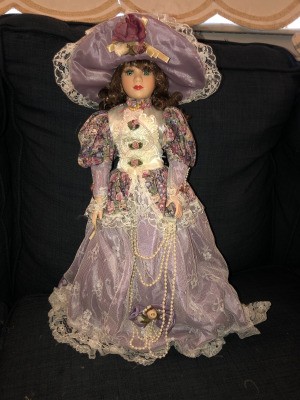 Identifying a Porcelain Doll - doll in Victorian dress of light purple and floral with matching hat