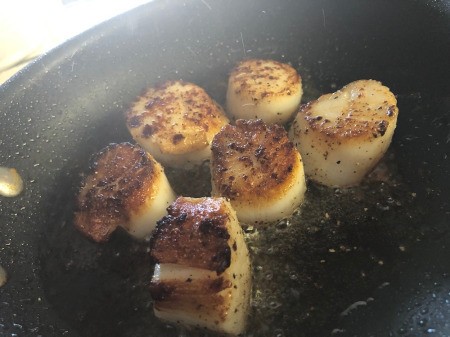 Scallops flipped over in pan