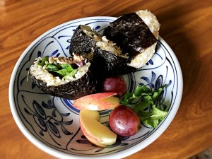 Tuna Mayo Onigiri with fruit on plate