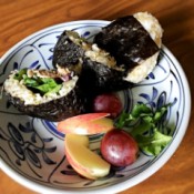 Tuna Mayo Onigiri with fruit on plate