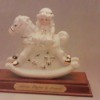 Identifying a Leornado Collection Figurine - white and gold figurine of a girl on a rocking horse