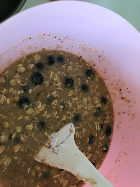 adding blueberries to bowl