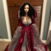 Identifying a Porcelain Doll - doll wearing a long ruby red dress with hood