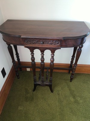 Value of a Mersman Table - wall table with ornate front and decorative legs