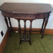 Value of a Mersman Table - wall table with ornate front and decorative legs