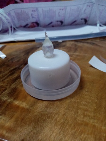 DIY Jar Lamp Wedding Souvenir - candle sitting inside the lid