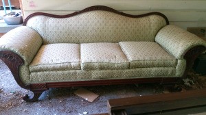Value of an Antique Couch - upholstered couch with wood trim on back, arms, front, and feet