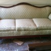 Value of an Antique Couch - upholstered couch with wood trim on back, arms, front, and feet