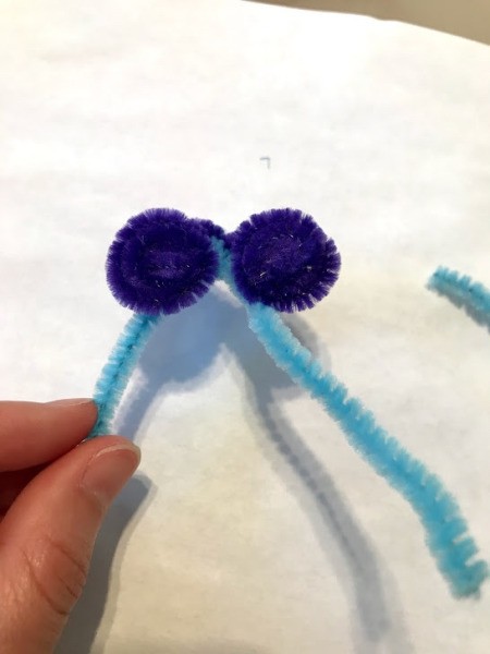 Pipe Cleaner Butterfly Ring - purple pipe cleaners rolled up