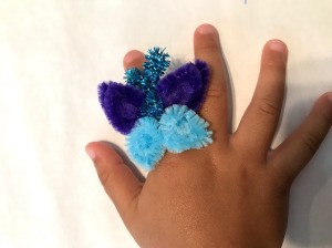 Pipe Cleaner Butterfly Ring - child's hand wearing the ring