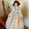 Identifying a Porcelain Doll - doll wearing colonial dress