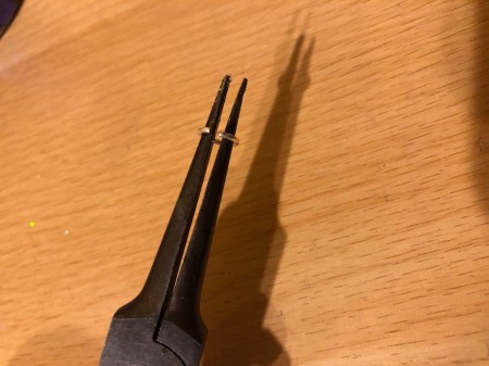 Making a Bottle Cap Glitter Pendant Necklace - open jump ring with pliers and string on chain