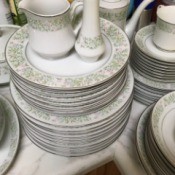 Value of Dinnerware Made in Japan - white dinnerware with a pink, green, and blue floral design around the edge