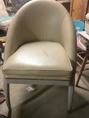 Identifying a Vintage Chair Style - half oval back, vinyl covered armless chair with brass studs across the front
