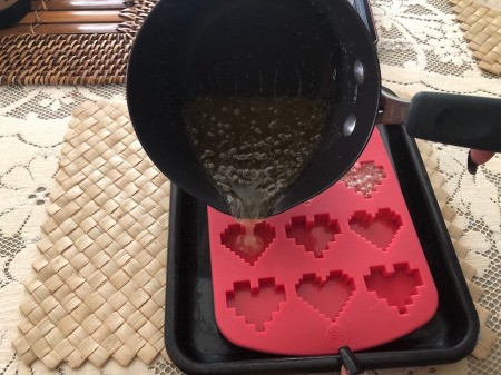 Making Rainbow Lollipops - quickly pour into the molds