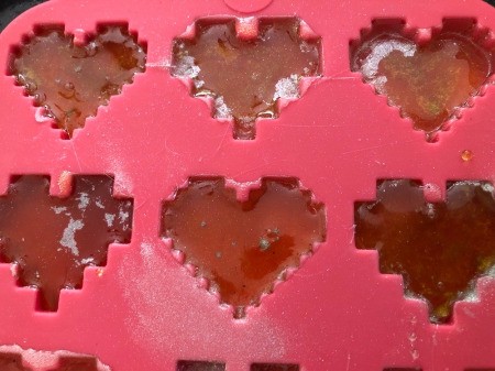 Making Rainbow Lollipops - cool completely and pop out