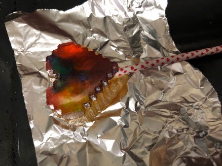 Making Rainbow Lollipops - then press on the other side