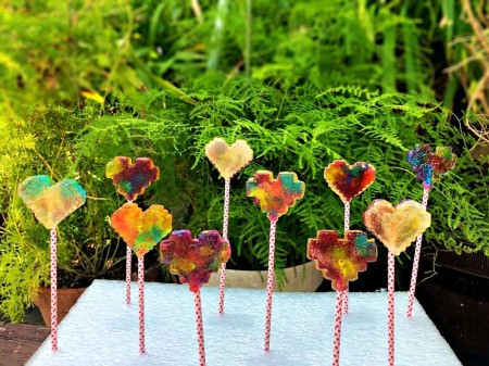 Making Rainbow Lollipops - looking through backlit lollies