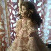 Identifying a Porcelain Doll - doll wearing a layered lace dress