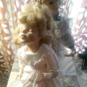 Identifying a Porcelain Doll - doll with eyes closed and mouth set for a kiss