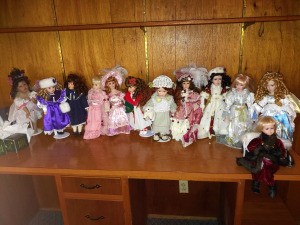 Selling a Porcelain Doll Collection  - dolls on a shelf