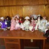 Selling a Porcelain Doll Collection  - dolls on a shelf