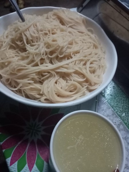 cooked angel hair pasta in a bowl