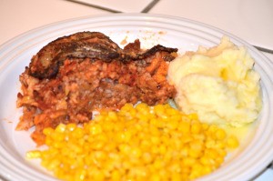 Stuffed Cabbage Casserole on plate with corn & potatoes