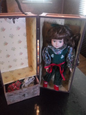 Identifying a Porcelain Doll - small doll in a carrying trunk with clothes hanging area and drawer