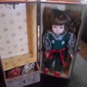 Identifying a Porcelain Doll - small doll in a carrying trunk with clothes hanging area and drawer