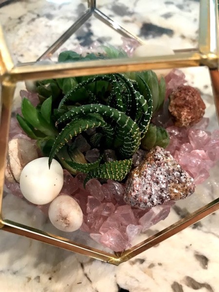 How to Make a Plant Terrarium - close up of various stones on top of the pink glass stones